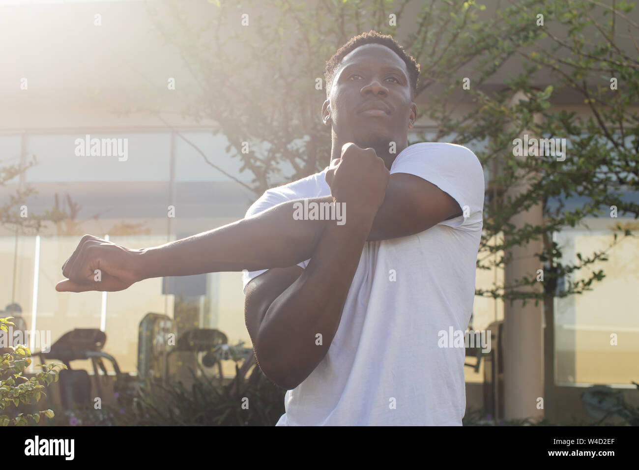 Man stretching arms hi-res stock photography and images - Alamy