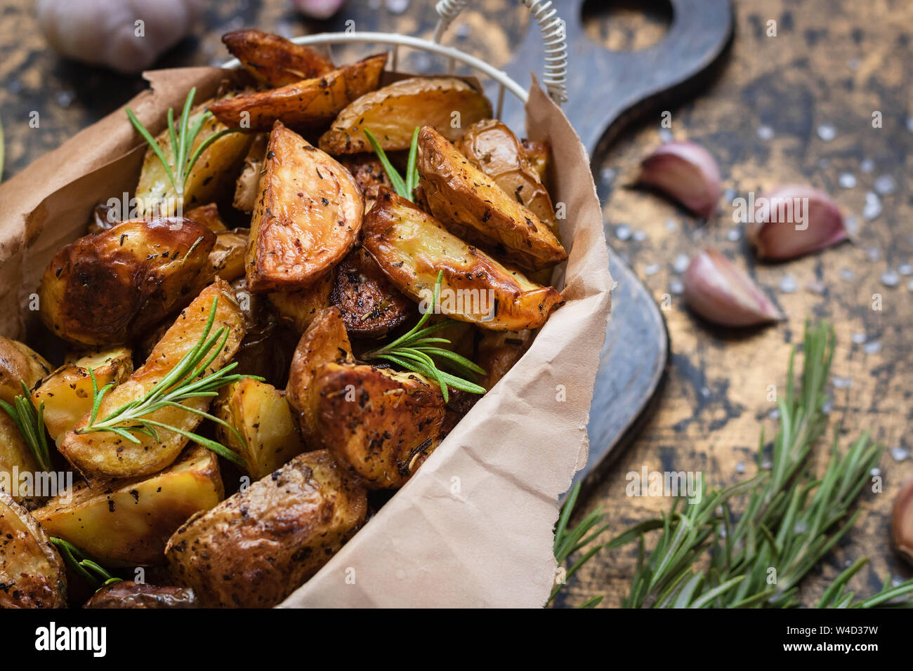 Baked young potatoes in a rustic style with rosemary, garlic and sumac ...