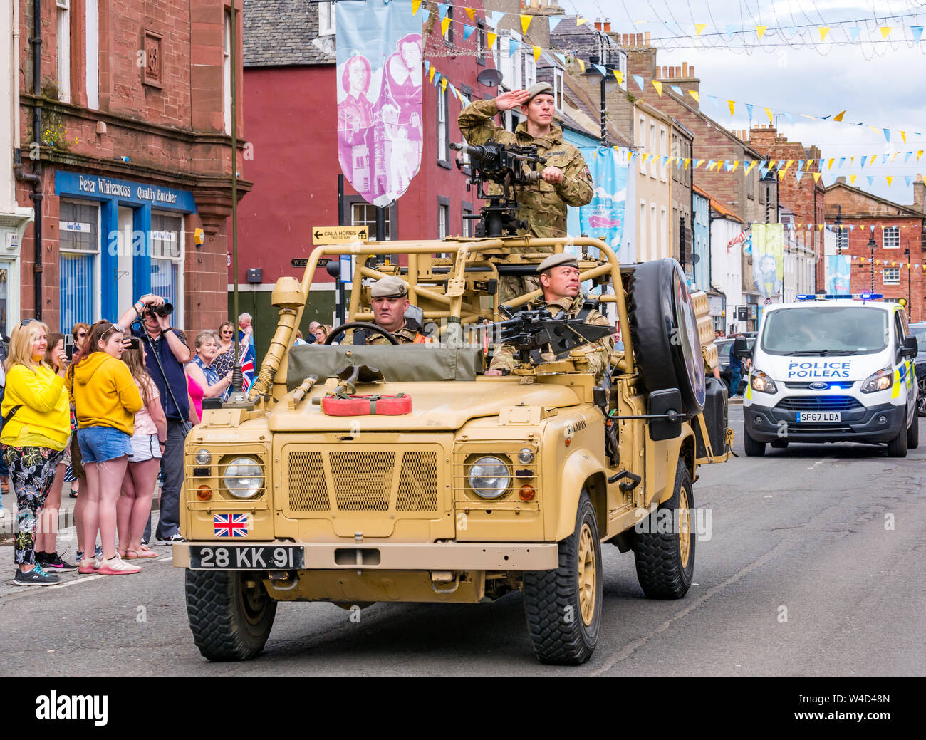 Lothian and Borders Yeomanry regiment parades through Dunbar High Street with a salute at Dunbar Town Hall, East Lothian, Scotland, UK Stock Photo