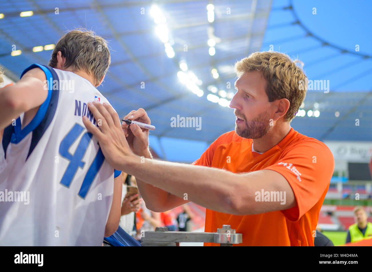 Leverkusen, Deutschland. 21st July, 2019. Dirk NOWITZKI signs an autograph  on his basketball jersey from Dallas Mavericks No. 41 Champions for  Charity, the charity football game in honor of Michael Schumacher, Team