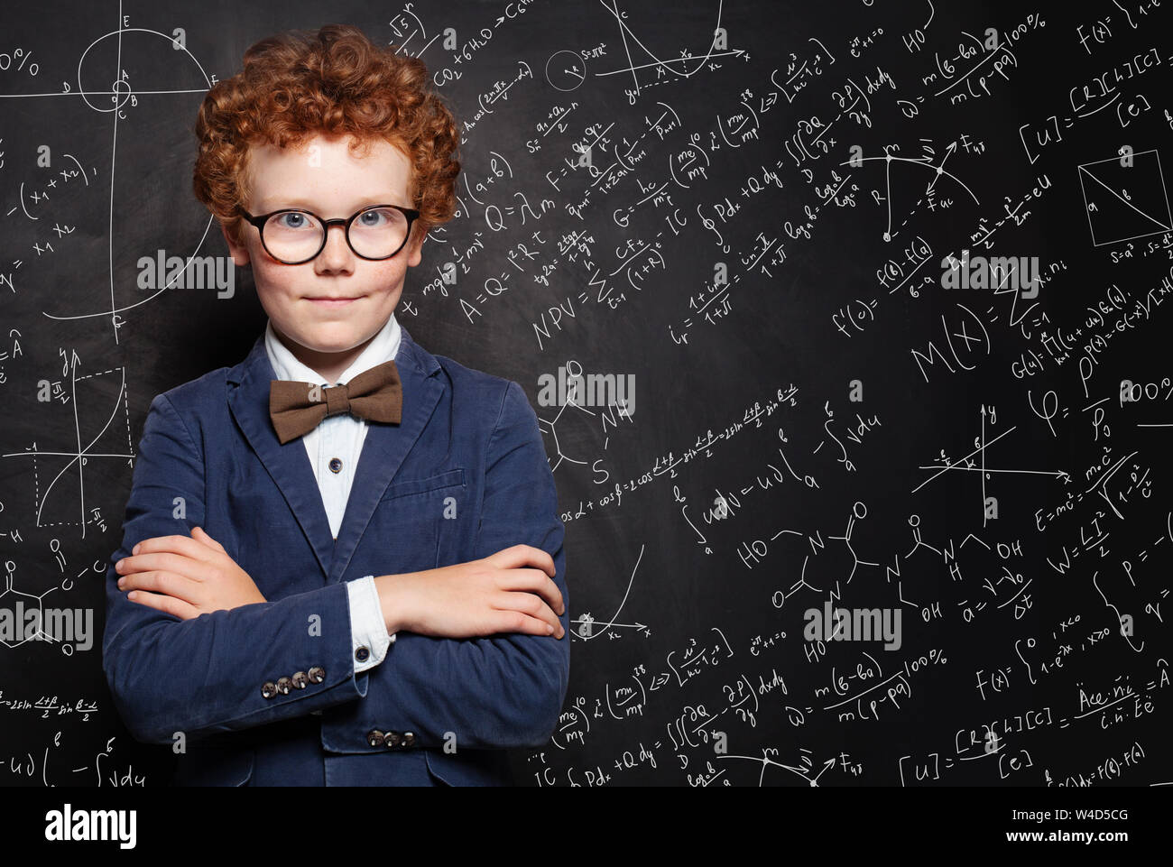 Happy smart kid boy portrait. How to pass exams Stock Photo