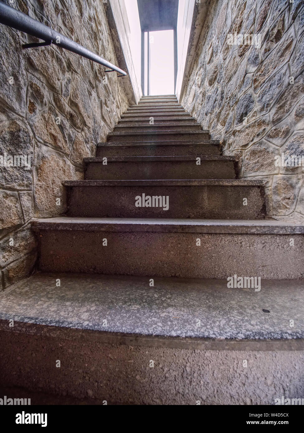 Interior of a narrow and steep staircase leading to the underground of the  medieval castle. Glass box entrance Stock Photo - Alamy, image size:976x1390