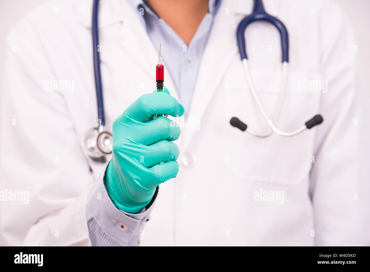 doctor hand holding medical tool,drug syringe Stock Photo