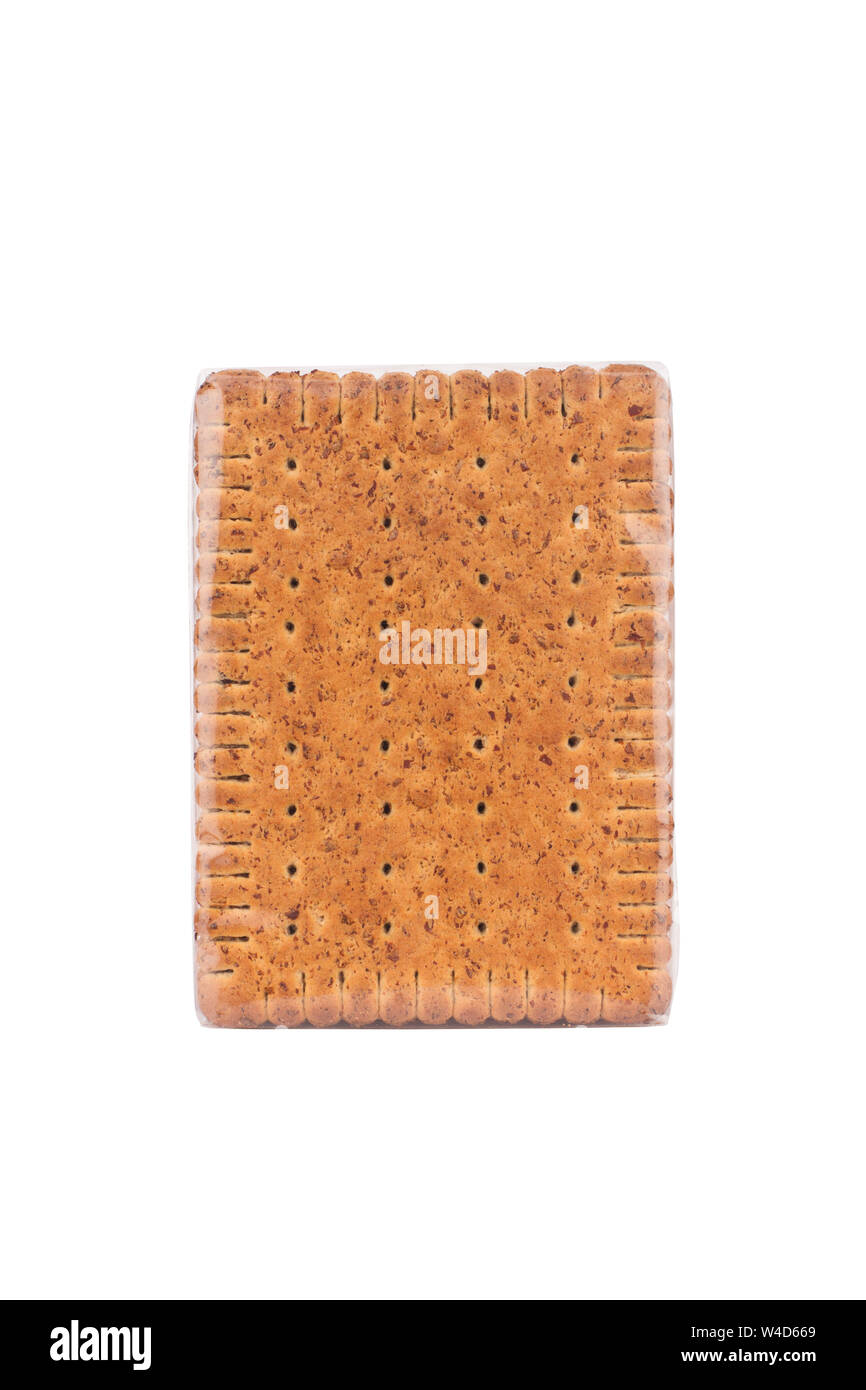 front view closeup of square shaped whole grain pack of brown biscuit in transparent plastic packaging isolated on white Stock Photo