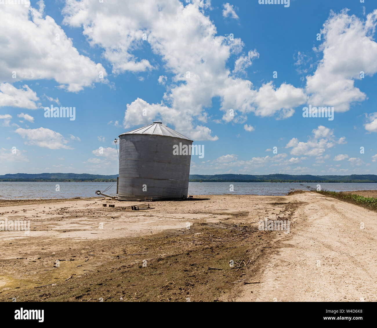 Mississippi River flooding has damaged farm building and grain bins, which is revealed as flood waters are receding Stock Photo
