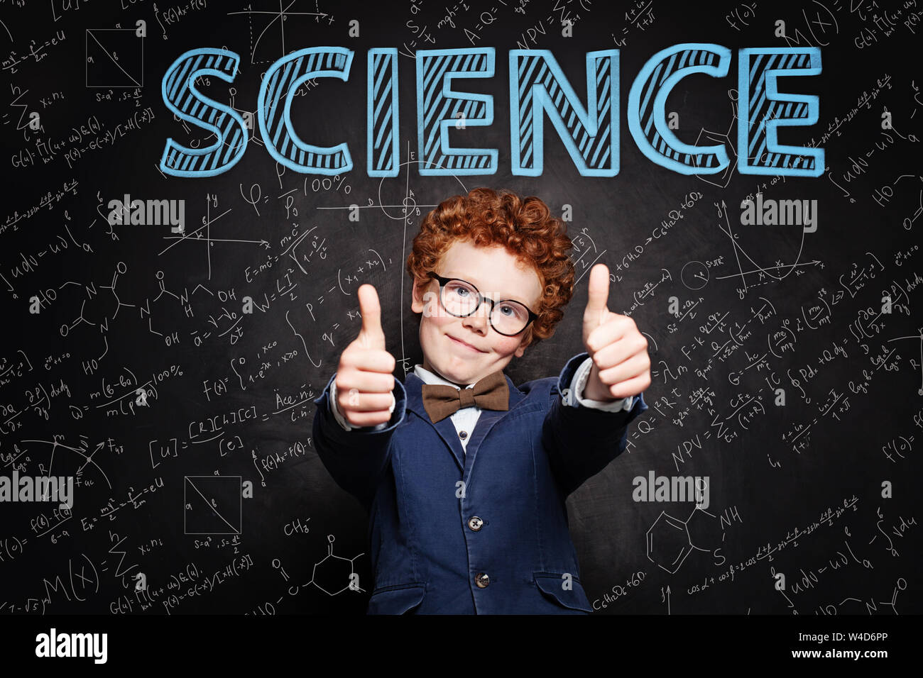 Happy kid pupil against science background Stock Photo