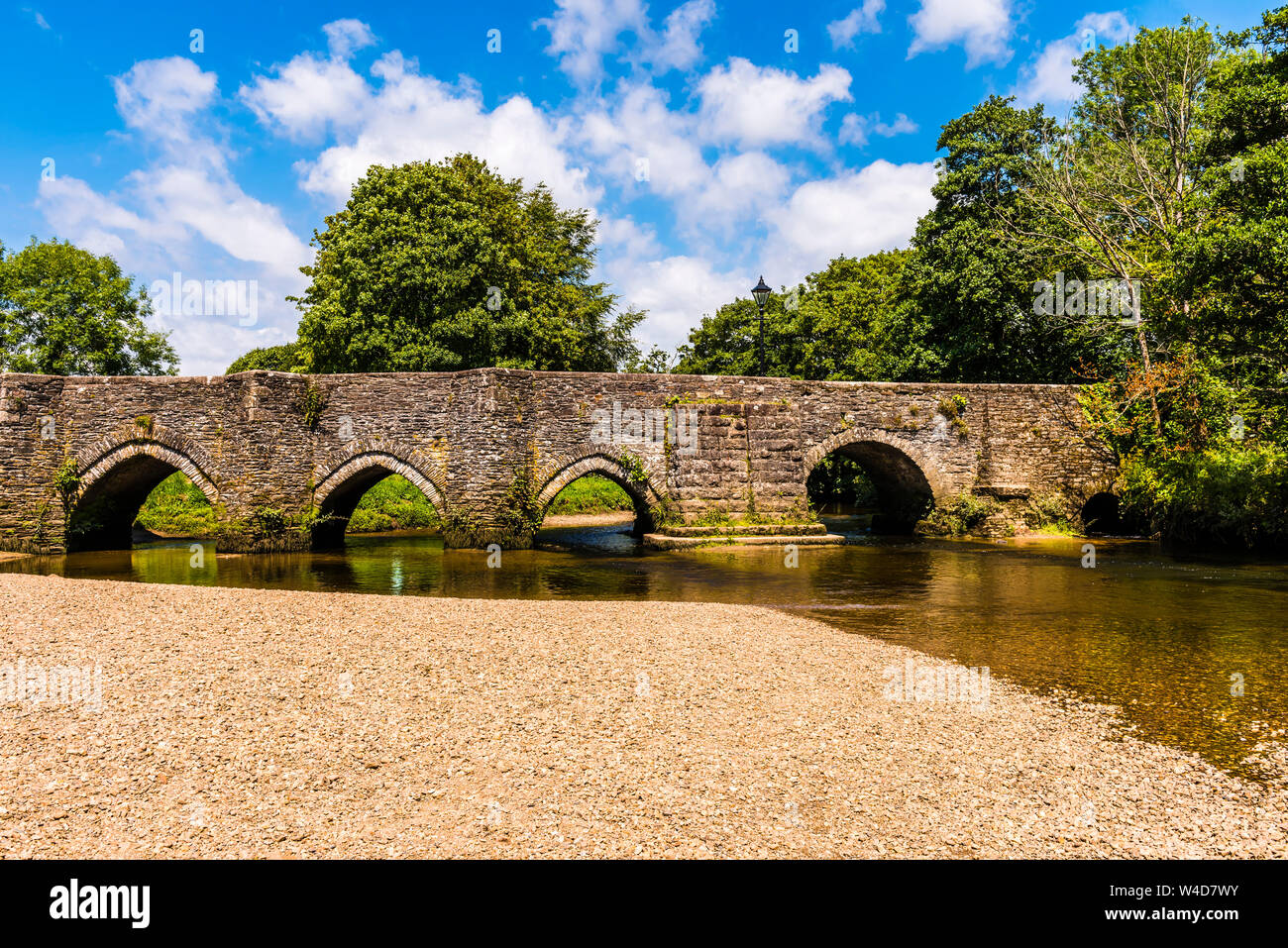 Medieval Bridge and gravel beach, Lostwithiel, Cornwall, UK Stock Photo