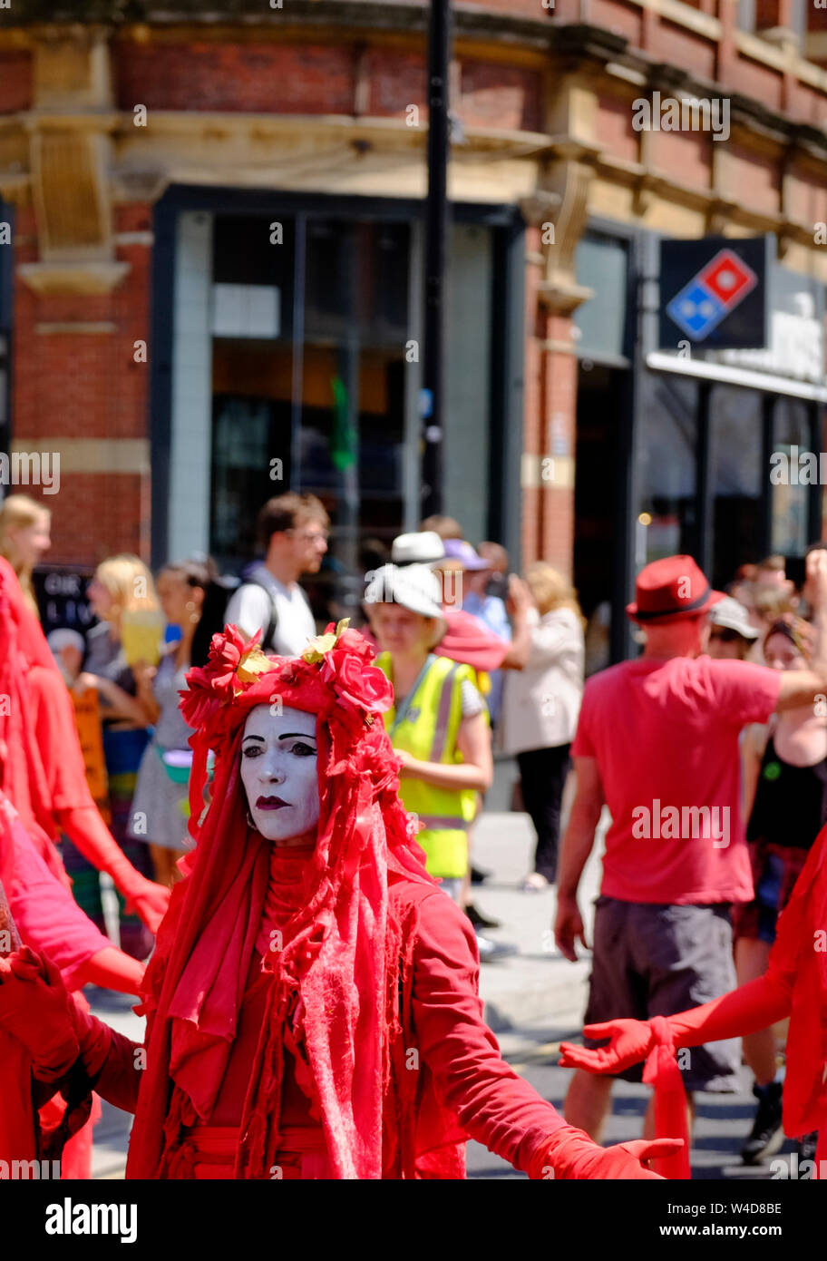 The Red Brigade support the Extinction rebellion movement summer uprising; a group have occupied Bristol Bridge in the center of the city. The protest Stock Photo