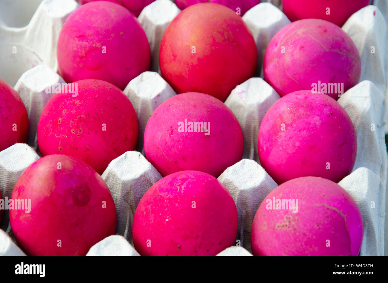 Pink slated eggs are a Filipino snack on sale here at a stall. Stock Photo