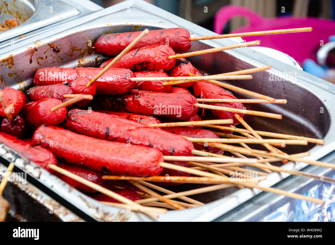 Filipino sausage cooked and served on sticks Stock Photo Alamy