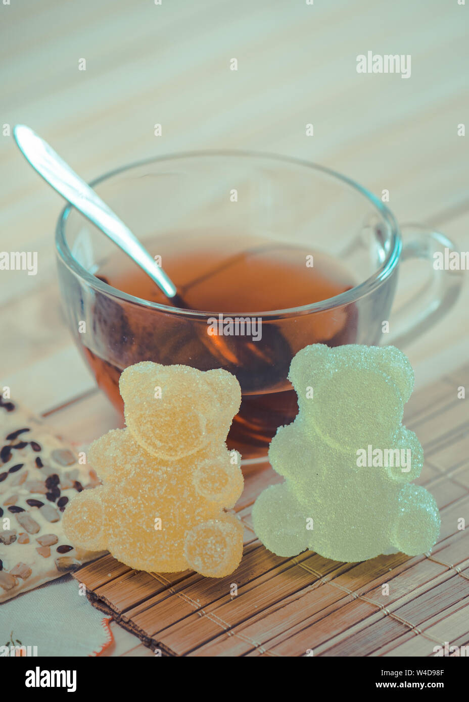 Marmalade bears and cereal cookies with tea Stock Photo