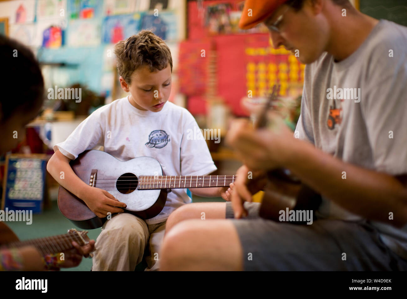 Boy and girl  at guitar lesson Stock Photo