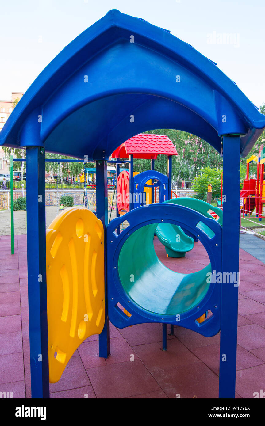 Colorful children's Playground with slides and swings outdoors in the