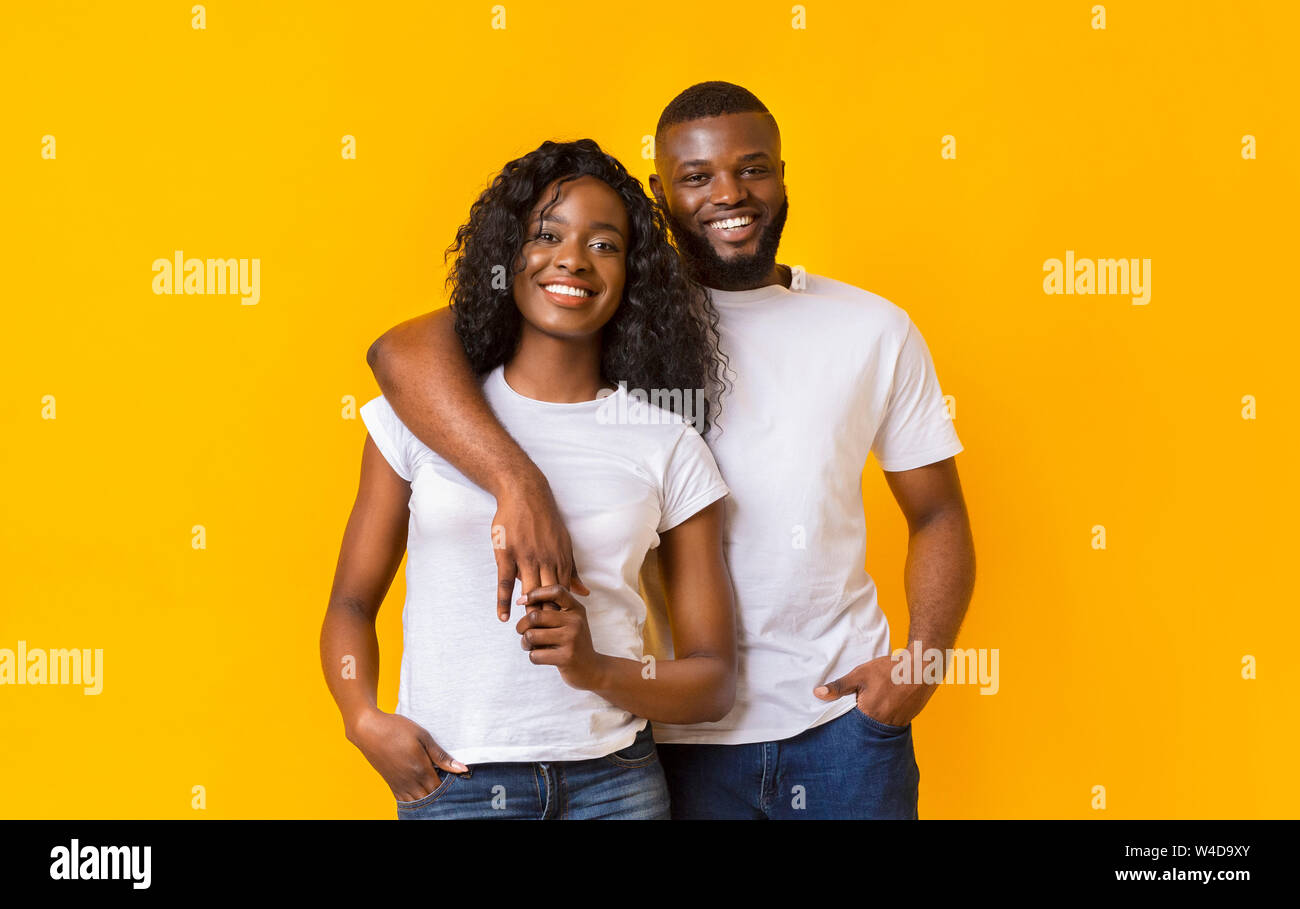 Happy Black Guy Is Hugging His Girl Stock Photo - Alamy