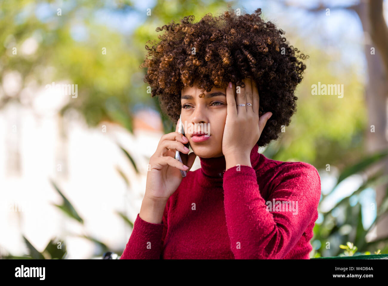 Outdoor portrait of a Young black African American young woman speaking ...