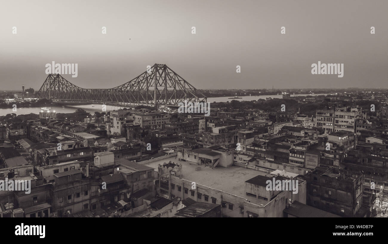 Aerial View of Famous Howrah bridge/ Rabindra Setu along with cityscape of Kolkata City. Stock Photo