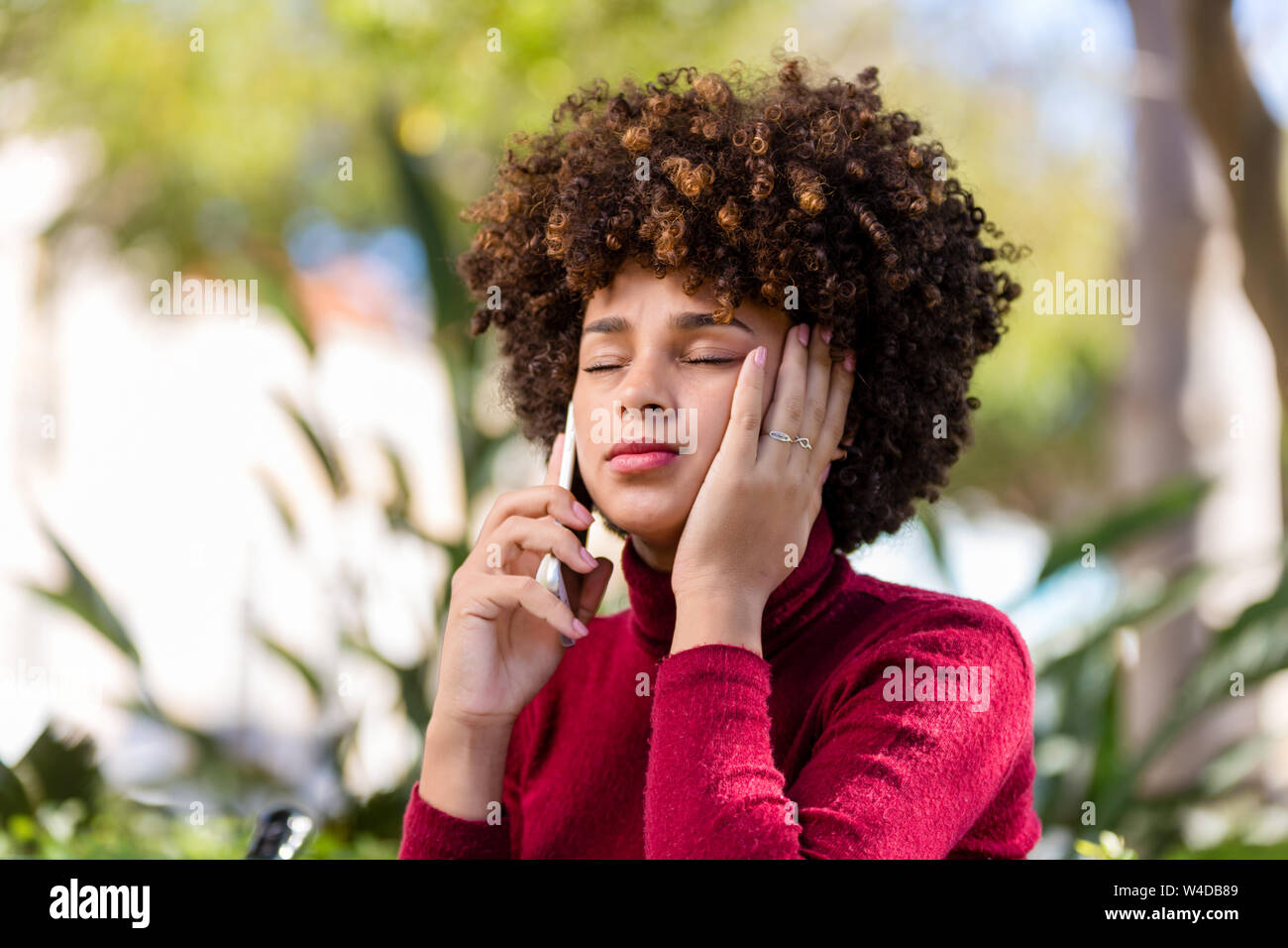 Outdoor portrait of a Young black African American young woman speaking ...