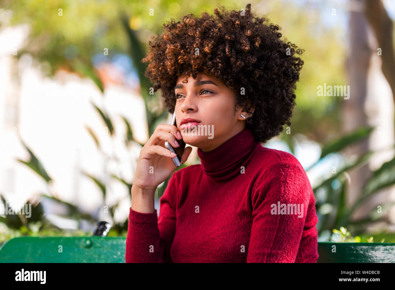 Outdoor portrait of a Young black African American young woman speaking ...
