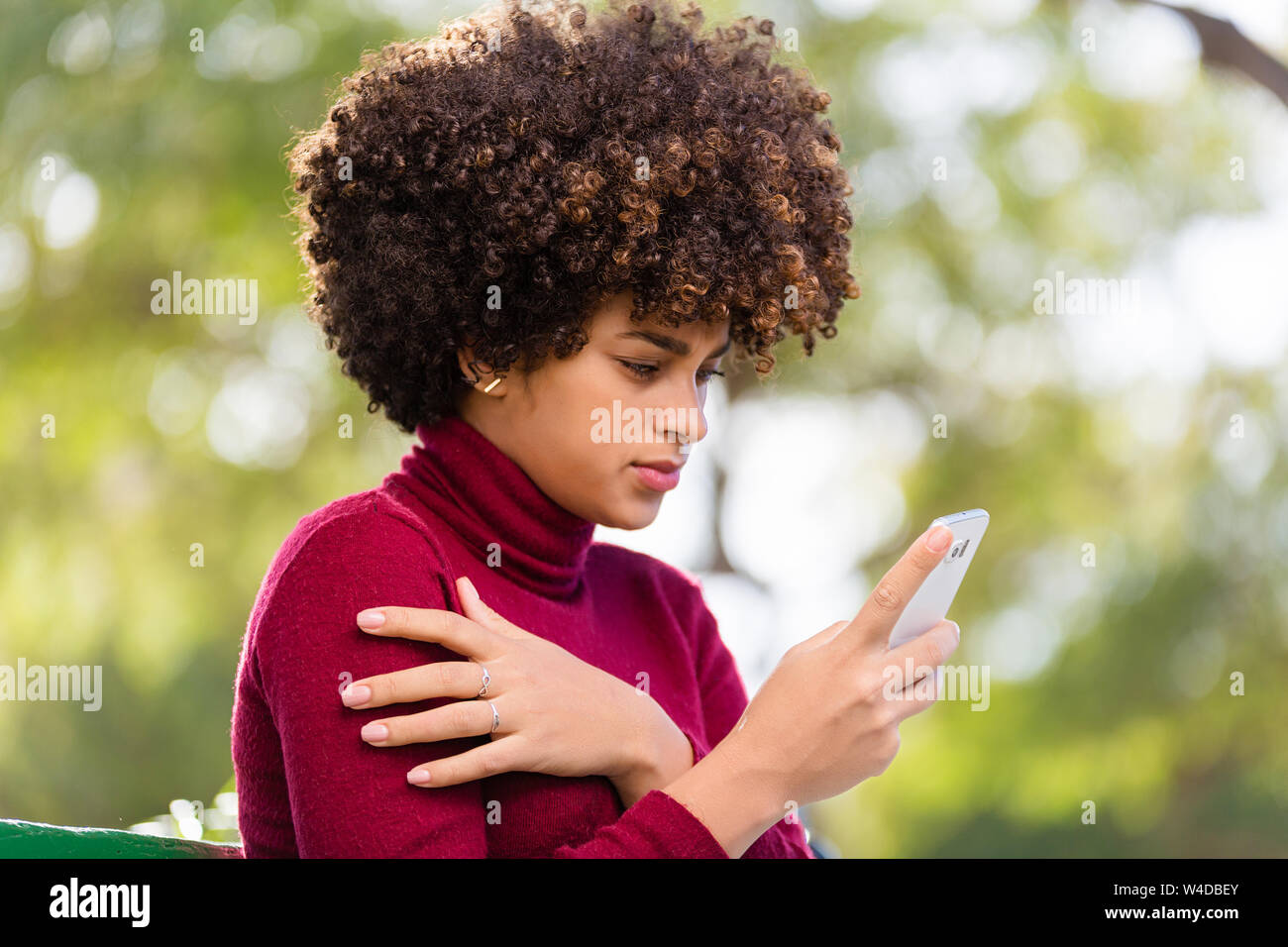 Outdoor portrait of a Young black African American young woman speaking ...