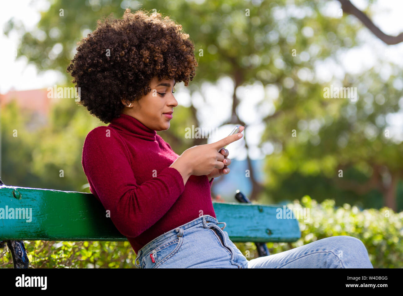 Outdoor portrait of a Young black African American young woman speaking ...