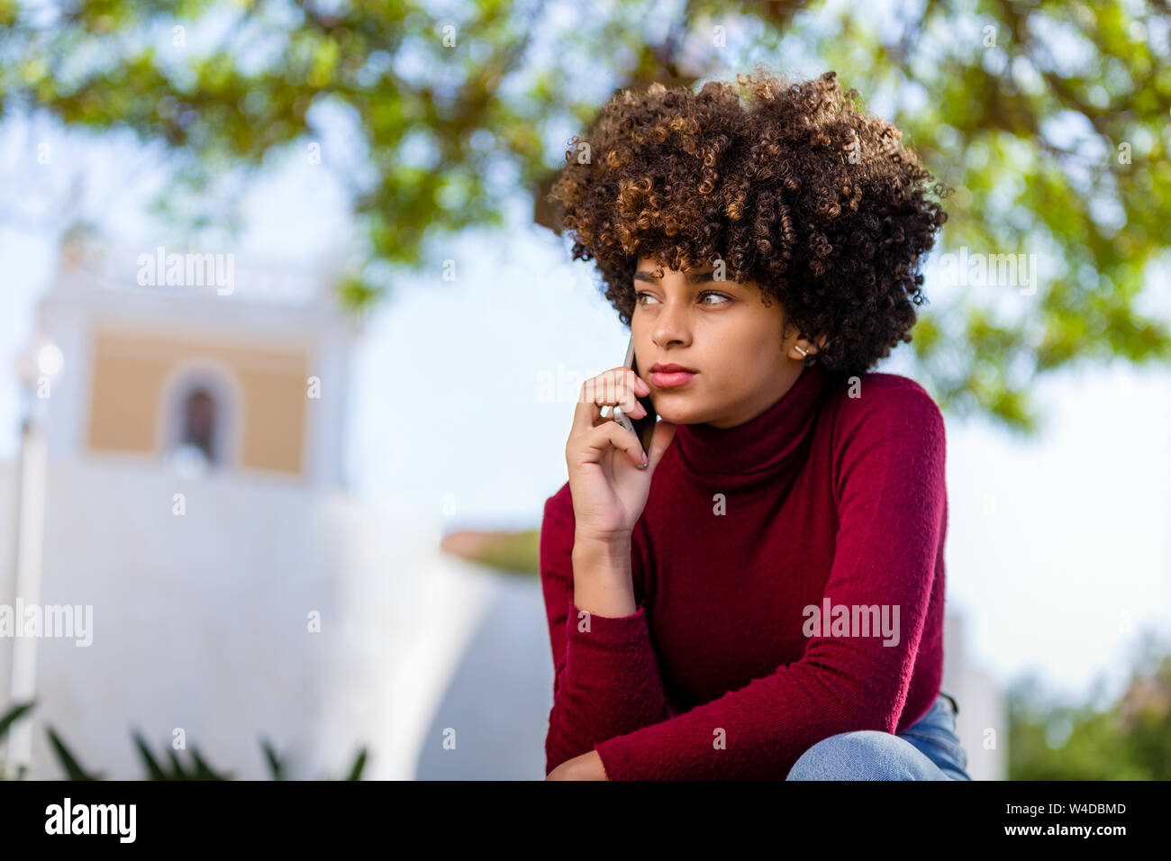 Outdoor portrait of a Young black African American young woman speaking ...