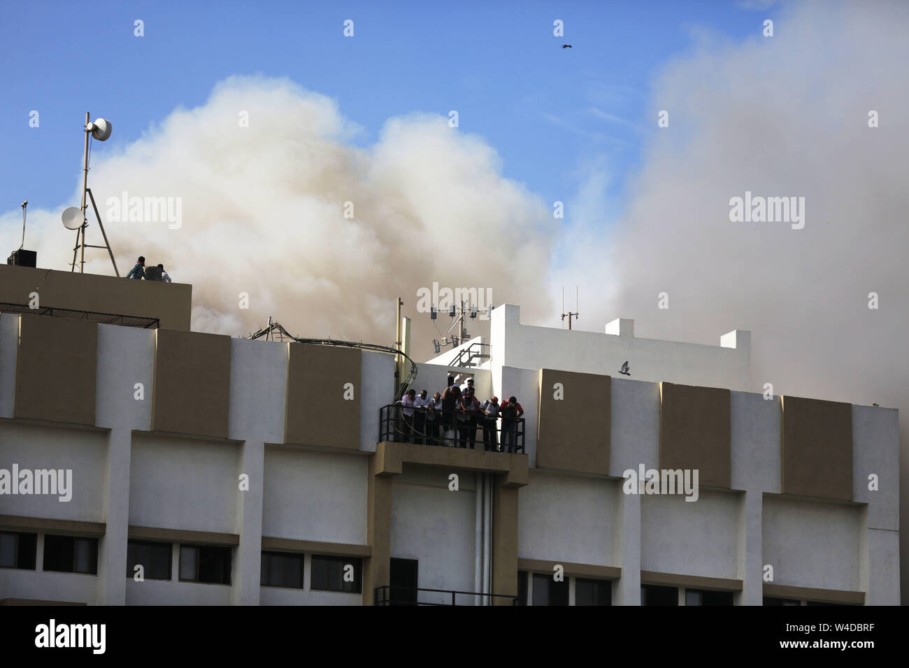 Mumbai, India. 22nd July, 2019. Indian firefighters rescue people from Mahanagar Telephone Nigam Limited (MTNL) building after a fire broke out in Mumbai, India, July 22, 2019. (Str/Xinhua) Credit: Xinhua/Alamy Live News Stock Photo