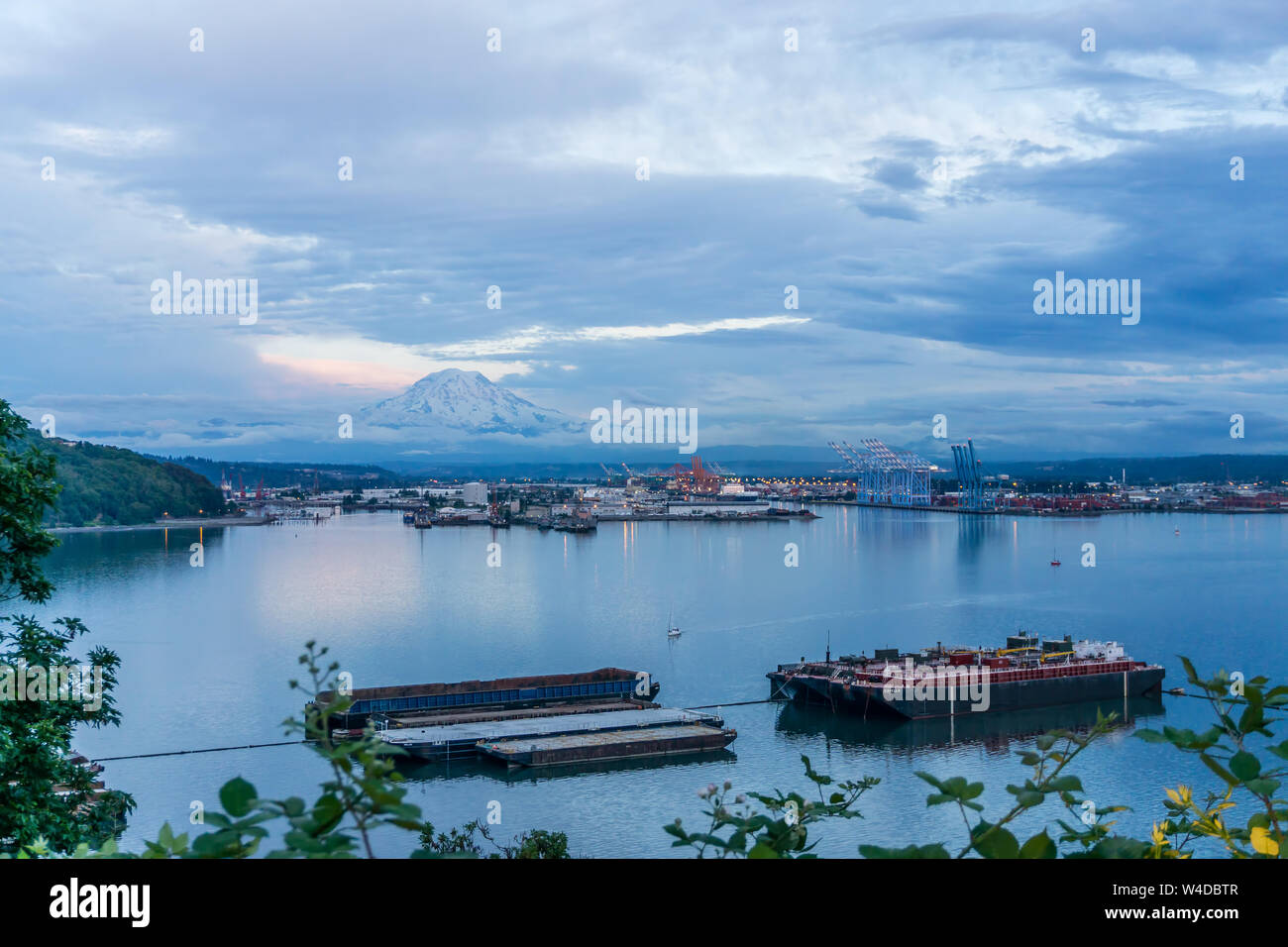A view of Mount Rainier and the Port of Tacoma at twilight Stock Photo ...
