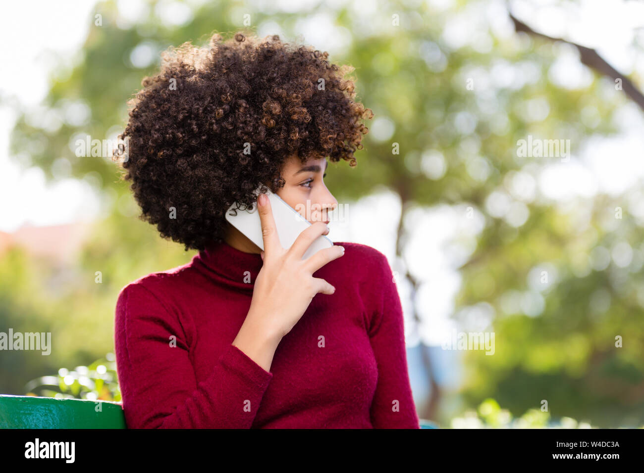 Outdoor portrait of a Young black African American young woman speaking ...