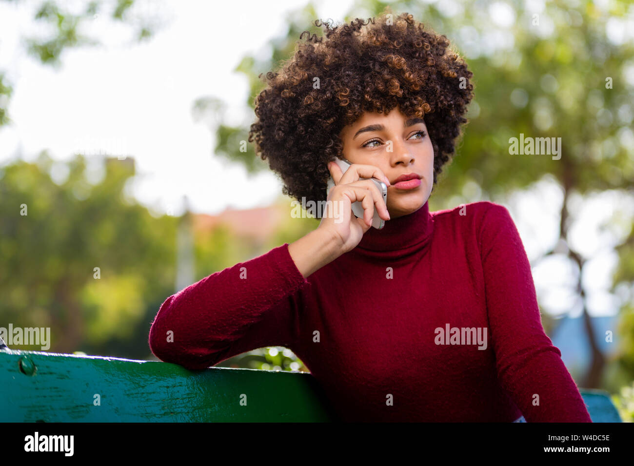 Outdoor portrait of a Young black African American young woman speaking ...