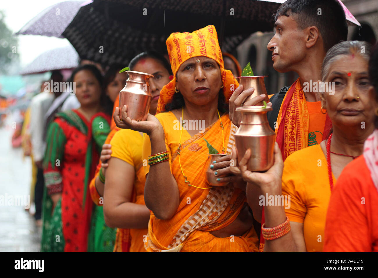 Kathmandu, Nepal, 22 July, 2019. A large number of devotees flocked to Shiva Temples on Shrawan. Devotees fast for entire month-especially on monday. Stock Photo