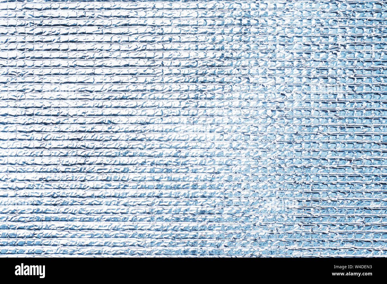 Silvery polyethylene texture Grey shiny background. Stock Photo