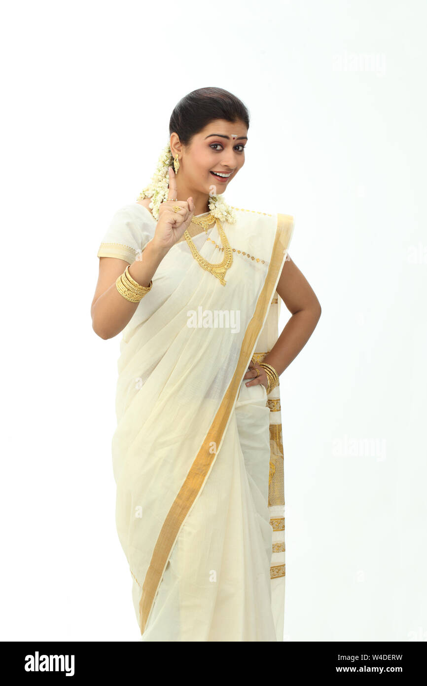 South Indian woman smiling and pointing upward Stock Photo - Alamy