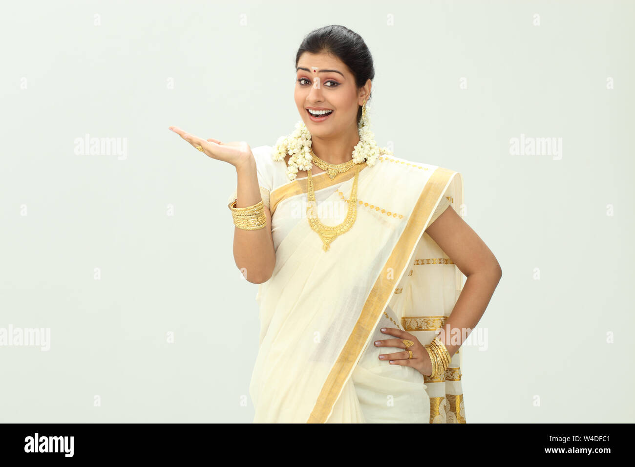 South Indian woman smiling and gesturing Stock Photo - Alamy