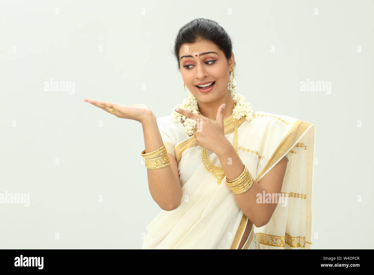 South Indian woman smiling and gesturing Stock Photo - Alamy