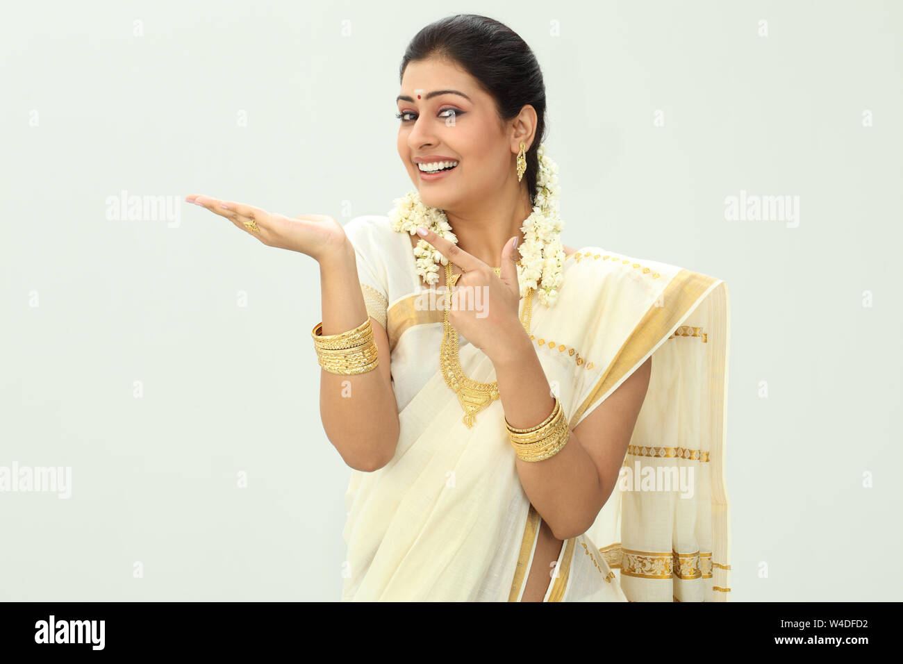 South Indian woman smiling and gesturing Stock Photo - Alamy