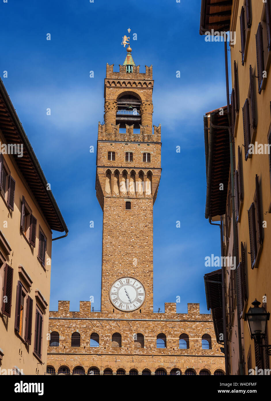 Palazzo Vecchio (Old Palace) clocktower, the beautiful Florence town hall erected in the 14th century and  designed by the famous medieval architect A Stock Photo