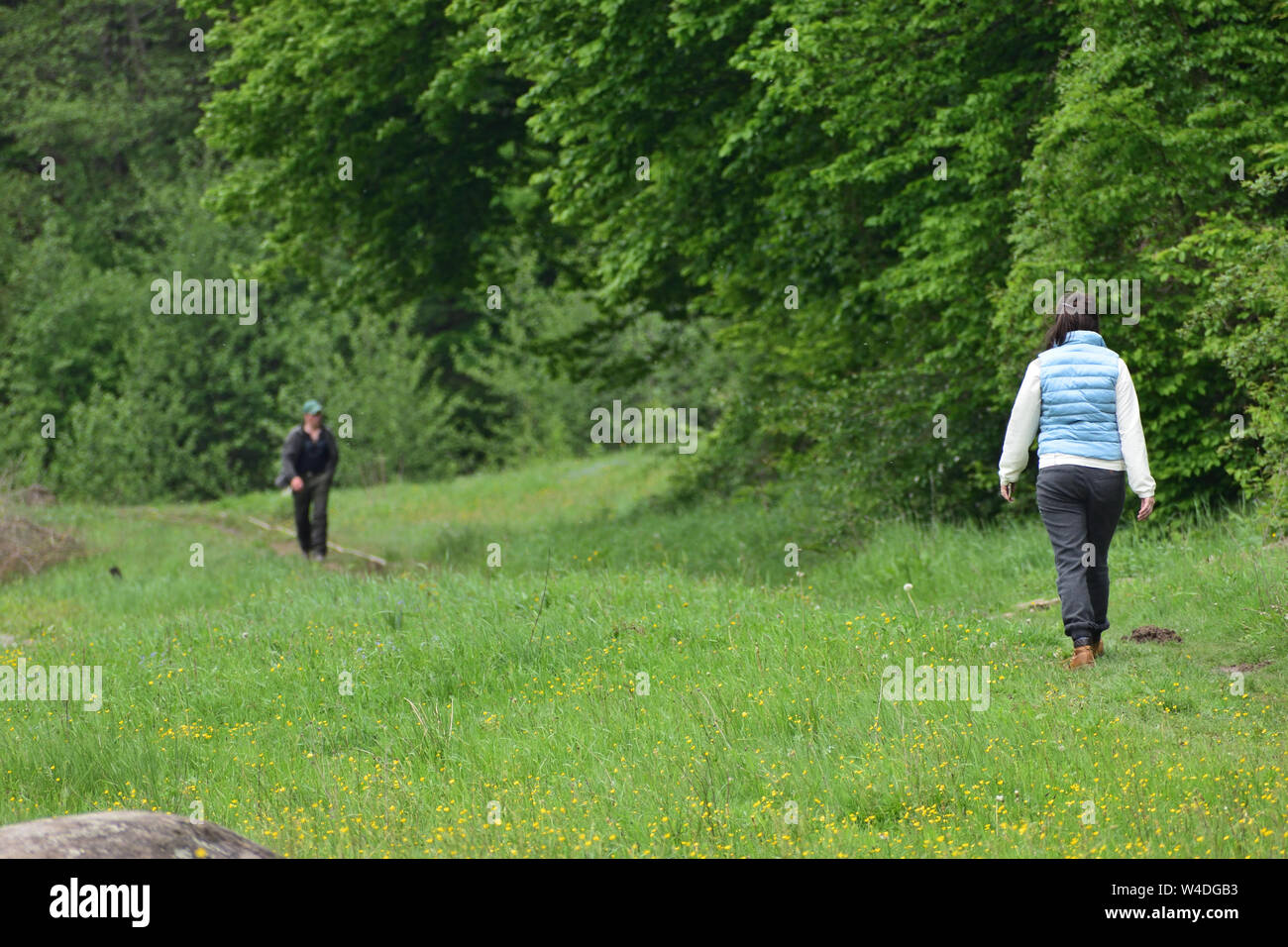 Man woman walk opposite direction hi-res stock photography and images ...