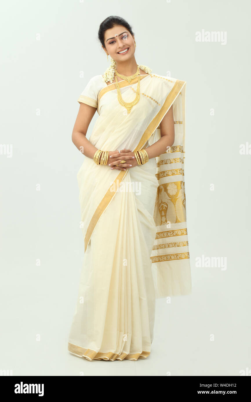 South Indian woman standing and smiling Stock Photo - Alamy