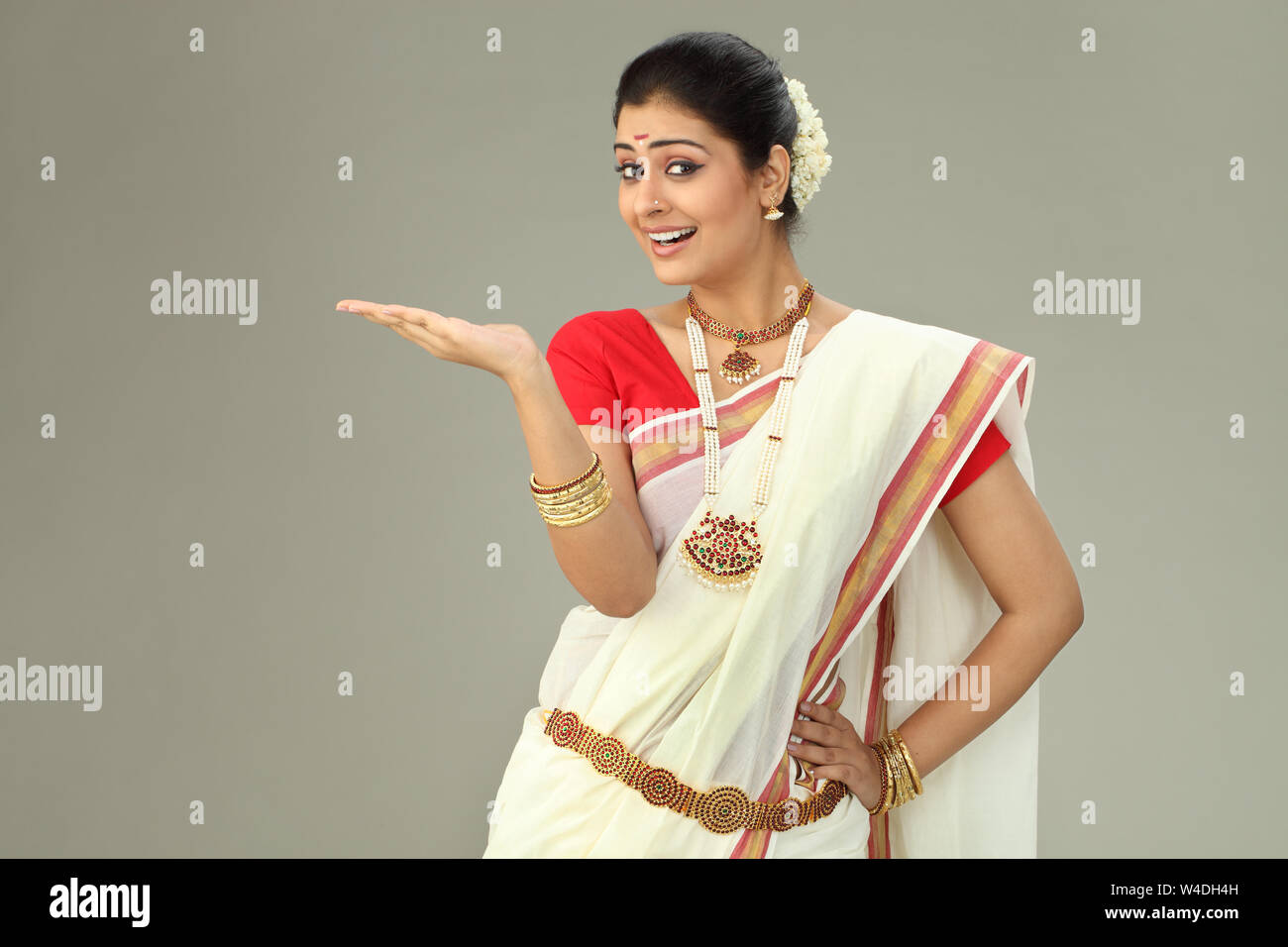 South Indian woman smiling and gesturing Stock Photo - Alamy