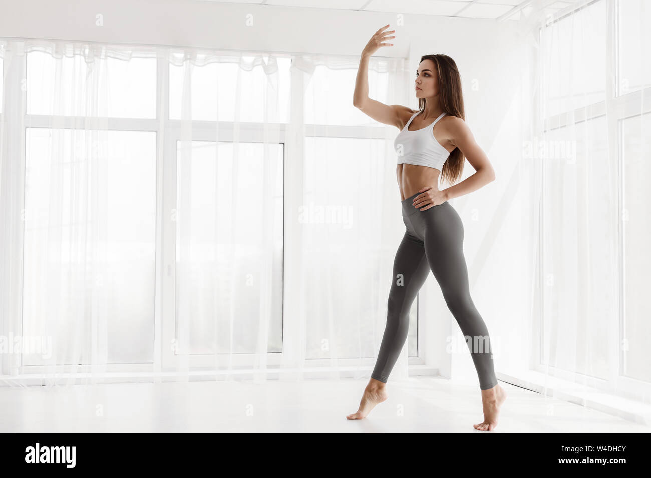 Woman Dancing Modern Ballet and Contemp Alone In Dance Class Stock Photo