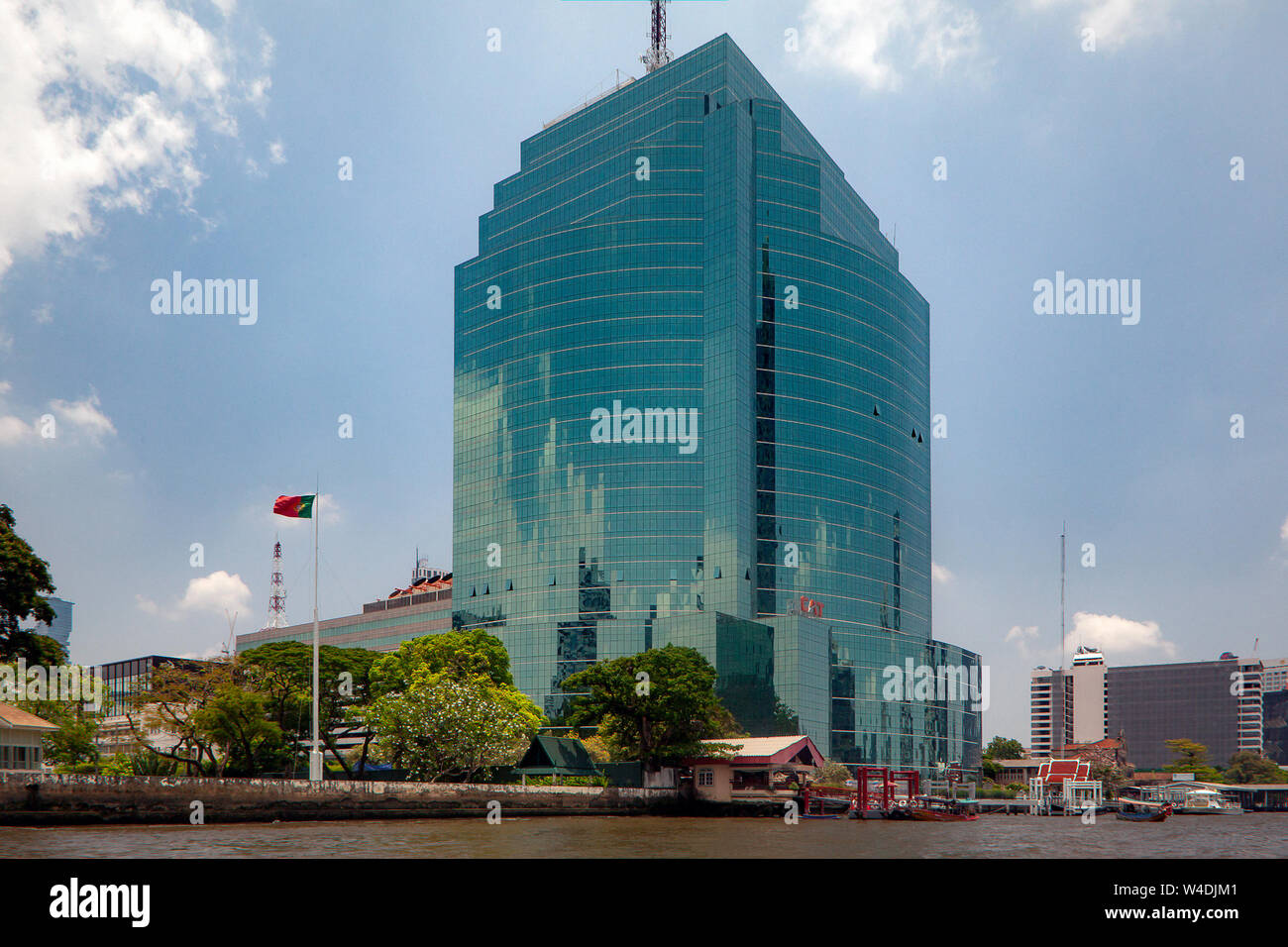 Modern architecture lines the ancient Chao Phraya River, the main waterway running through Bangkok City, Thailand. Stock Photo