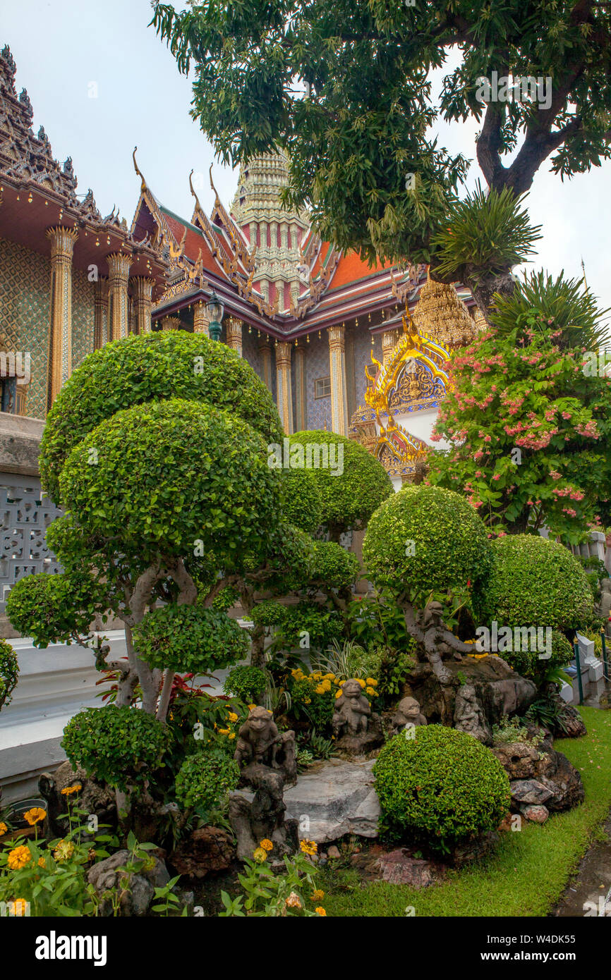 Manicured landscaping near the Temple of the Emerald Buddha at the Grand Palace of Bangkok, Thailand. Stock Photo