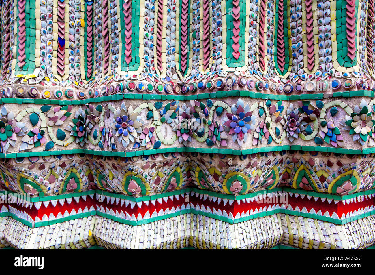 Intricate inlaid glass mosaic designs at the Grand Palace in Bangkok, Thailand. Stock Photo