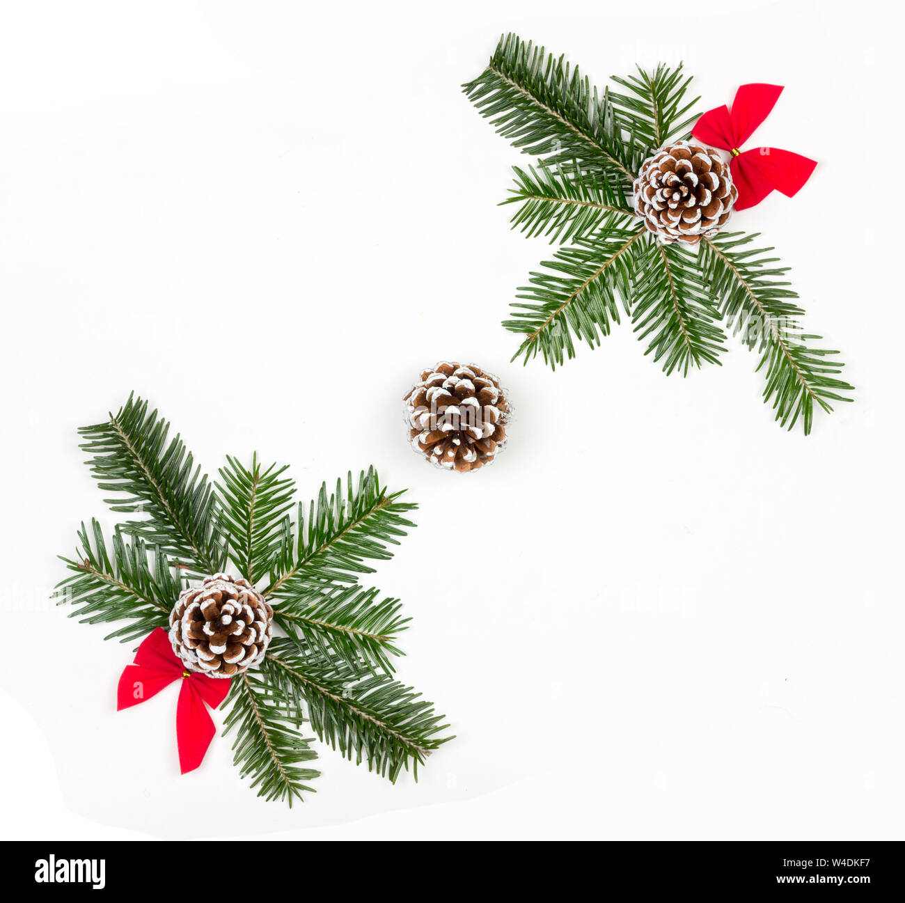 Christmas composition of fir branches of red bows and pine cones on a ...