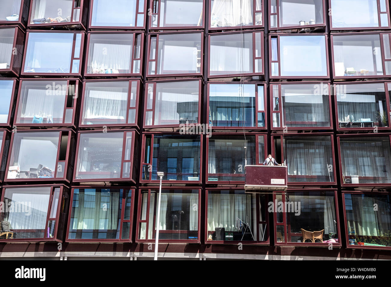 Amsterdam, Netherlands, residential house at NDSM Werf, large window facades, conservatories, window cleaners, Stock Photo