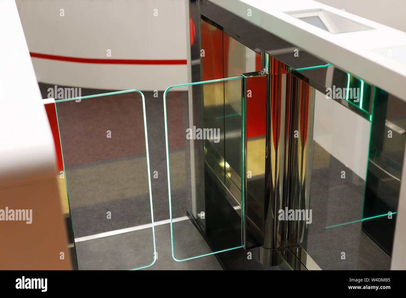 Automatic stainless steel waist height turnstile system. Selective focus. Stock Photo