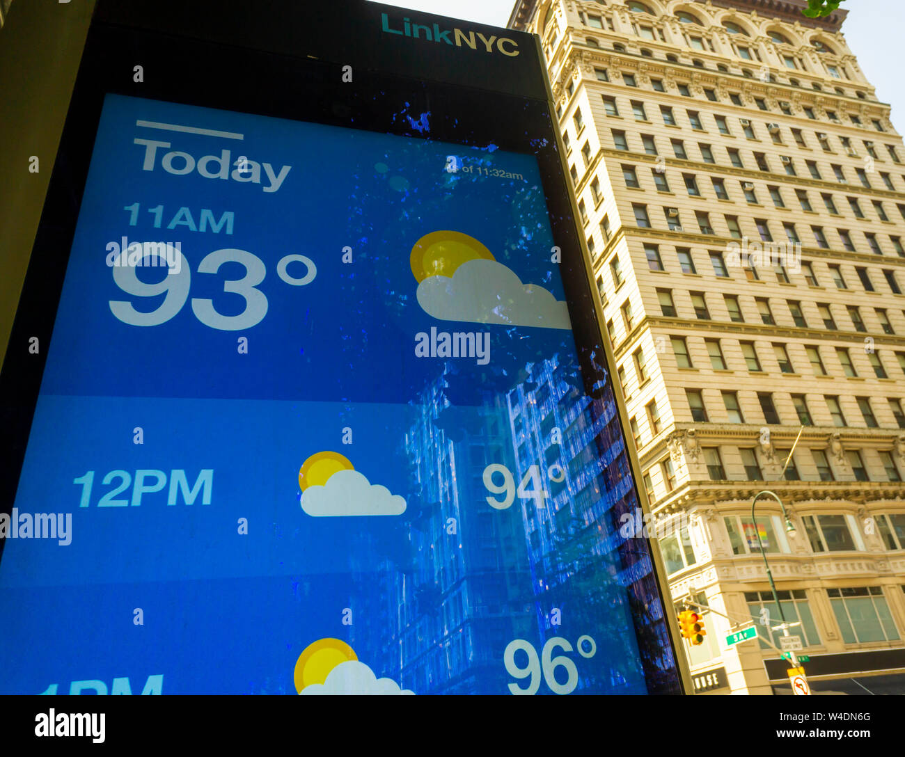 A LinkNYC street kiosk displays the temperature at 11AM in the Chelsea neighborhood of New York on Saturday, July 20, 2019. An excessive heat warning is in effect in New York from noon Friday until 8PM Sunday as the oppressive combination of heat and humidity will make it feel like 105 degrees F. (© Richard B. Levine) Stock Photo