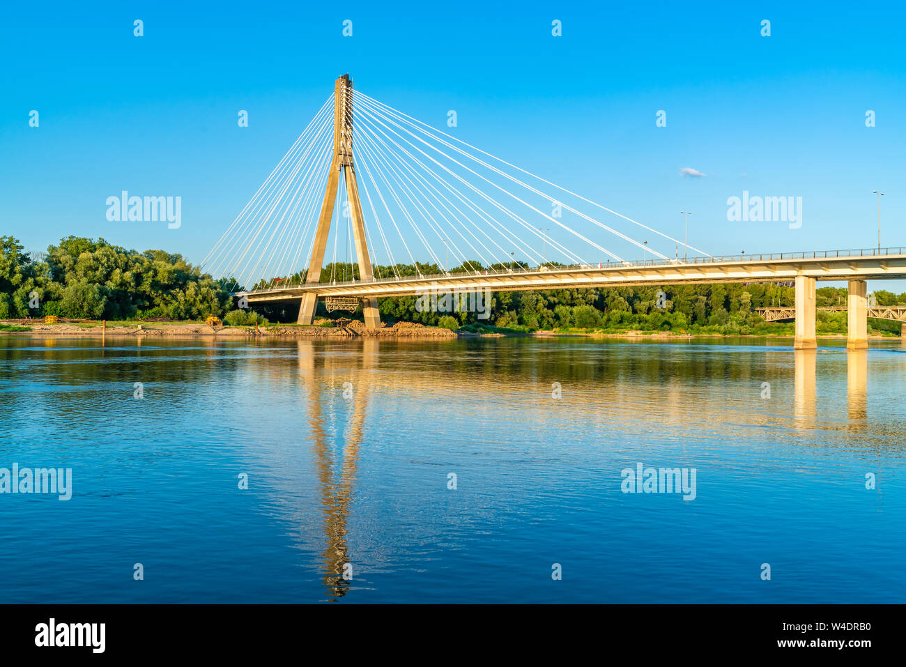 WARSAW, POLAND - JULY 18, 2019: Opened on 06/10/2000, a 479 meters long Swietokrzyski cable-stayed bridge over the Vistula river in Warsaw links Powis Stock Photo