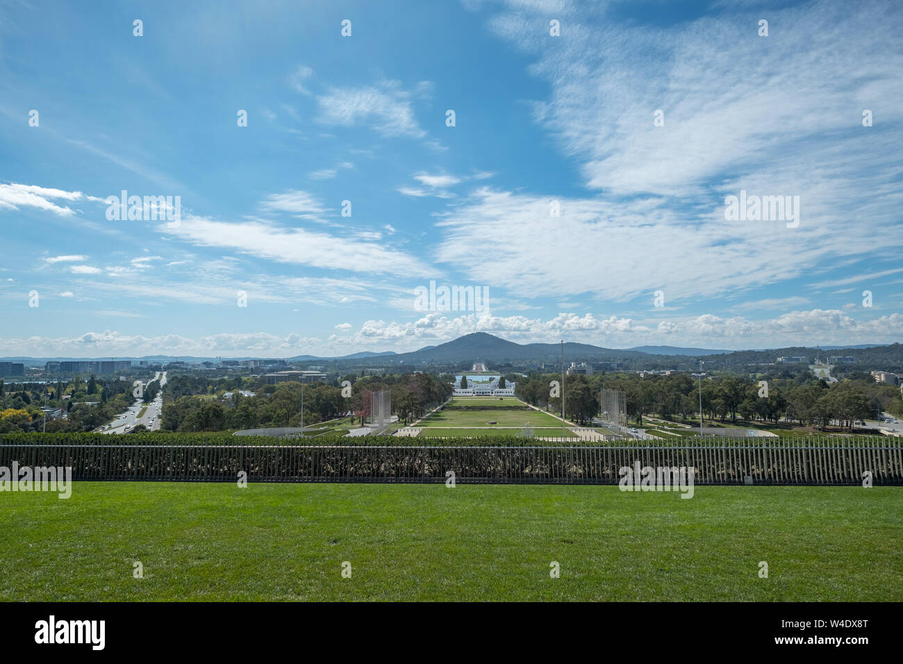 View NE from Capital Hill, Canberra with the grounds of the current Parliament House and old Parliament House in the distance Stock Photo