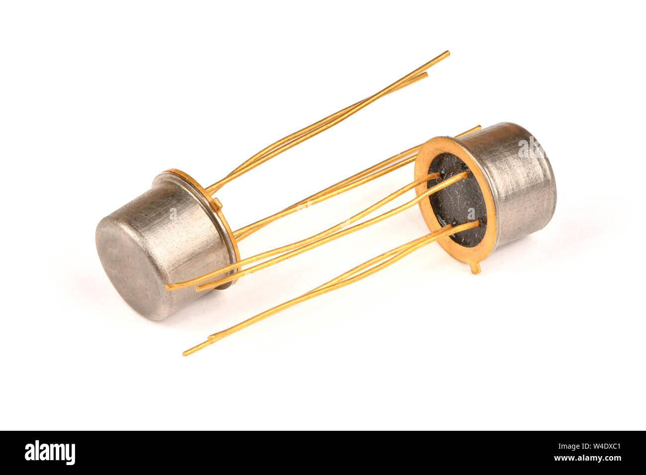 Old radio component, the semiconductor transistor with the contacts covered with gold on a white background. High resolution photo. Full depth of fiel Stock Photo